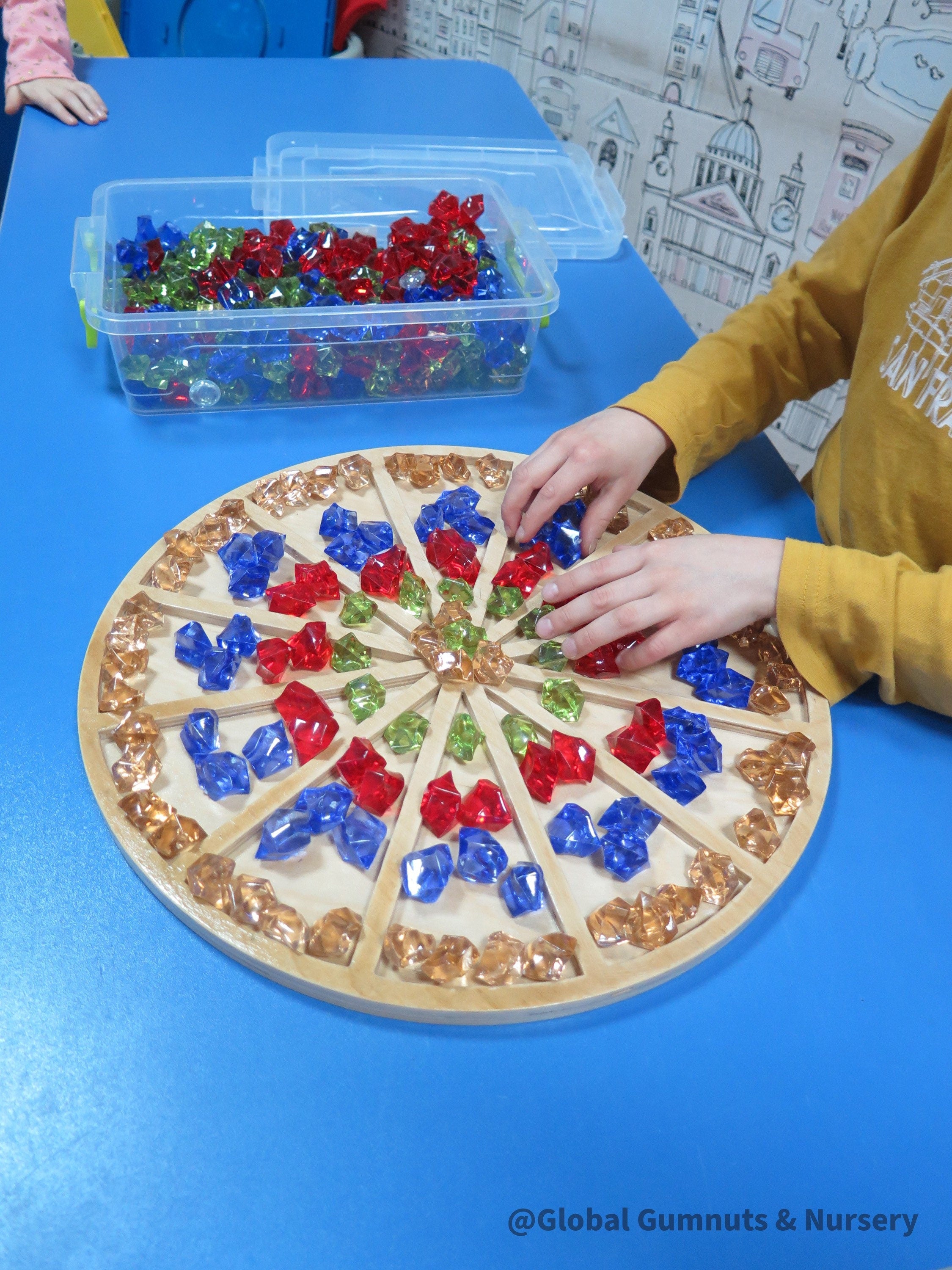 Wooden sorting board with 12 colorful sections for educational activities like counting, color sorting, and clock learning.