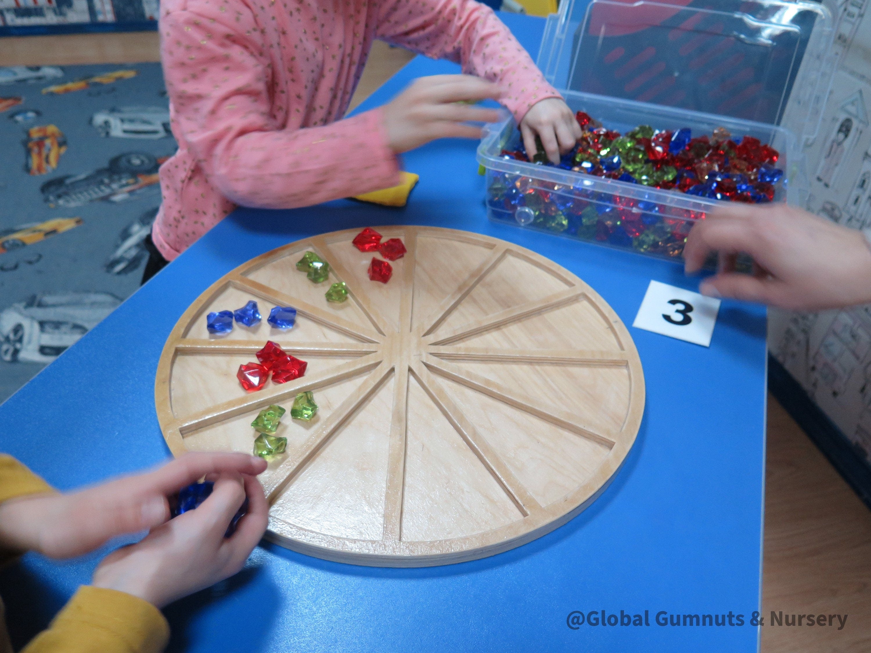 Wooden sorting board with 12 colorful sections for educational activities like counting, color sorting, and clock learning.