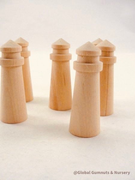 Mini wooden lighthouse, a charming addition to beach-themed decor or playtime.