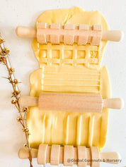 Set of 3 Patterned Rolling Pins: Wooden rolling pins with various patterns for creative play.