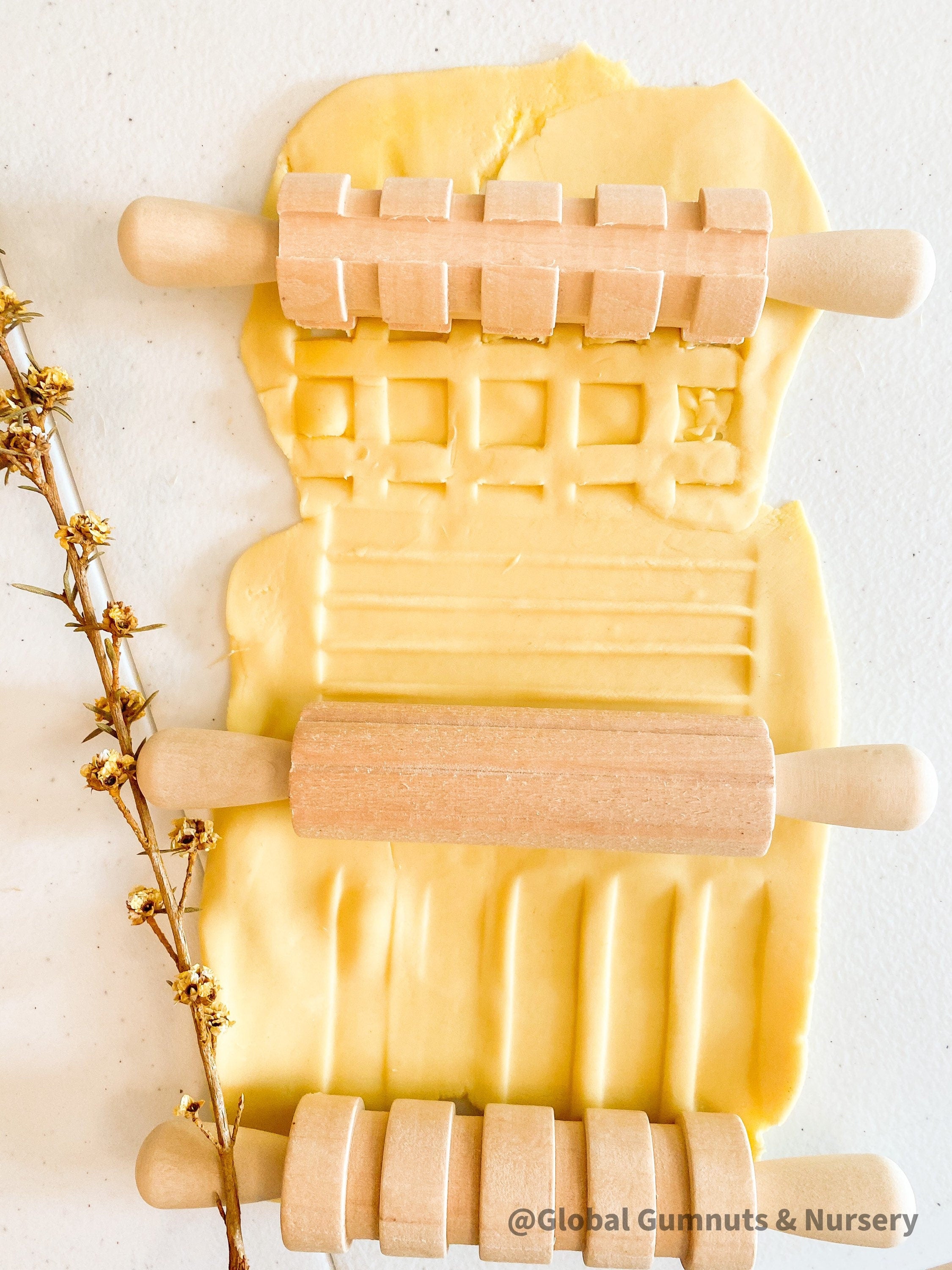 Set of 3 Patterned Rolling Pins: Wooden rolling pins with various patterns for creative play.