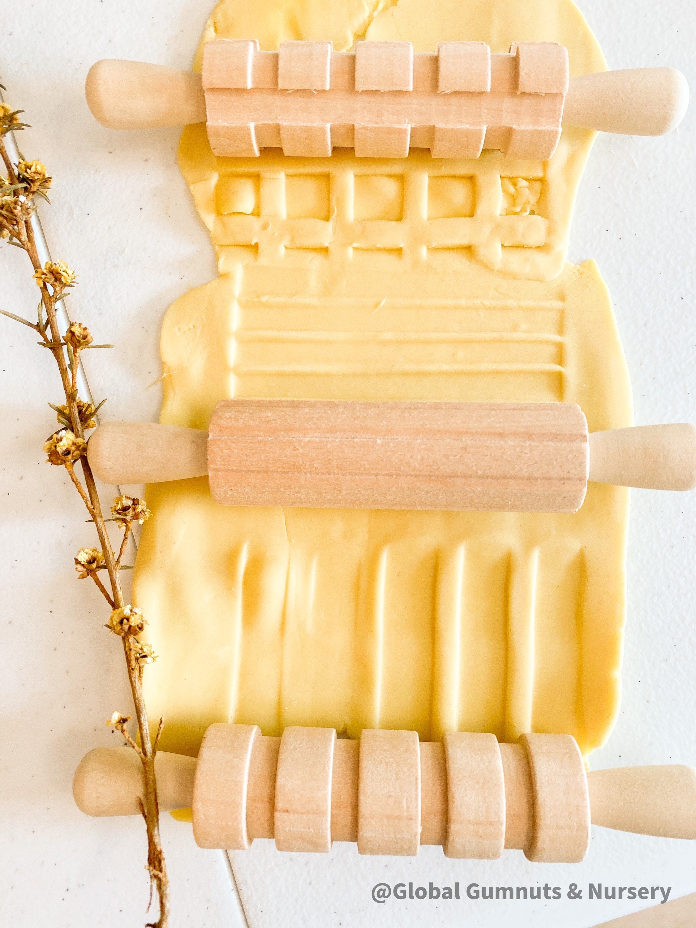 Set of 3 Patterned Rolling Pins: Wooden rolling pins with various patterns for creative play.