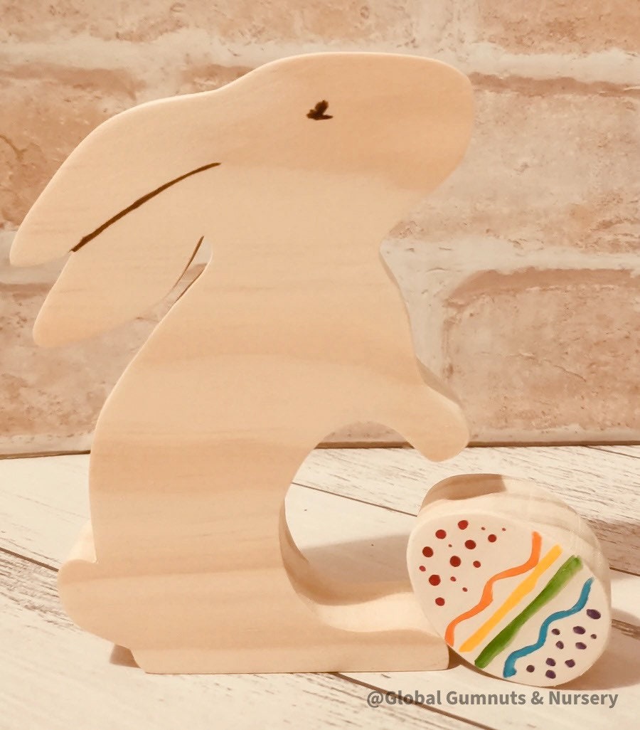 Handmade wooden bunny and egg set, a charming Easter-themed decor or playtime accessory.