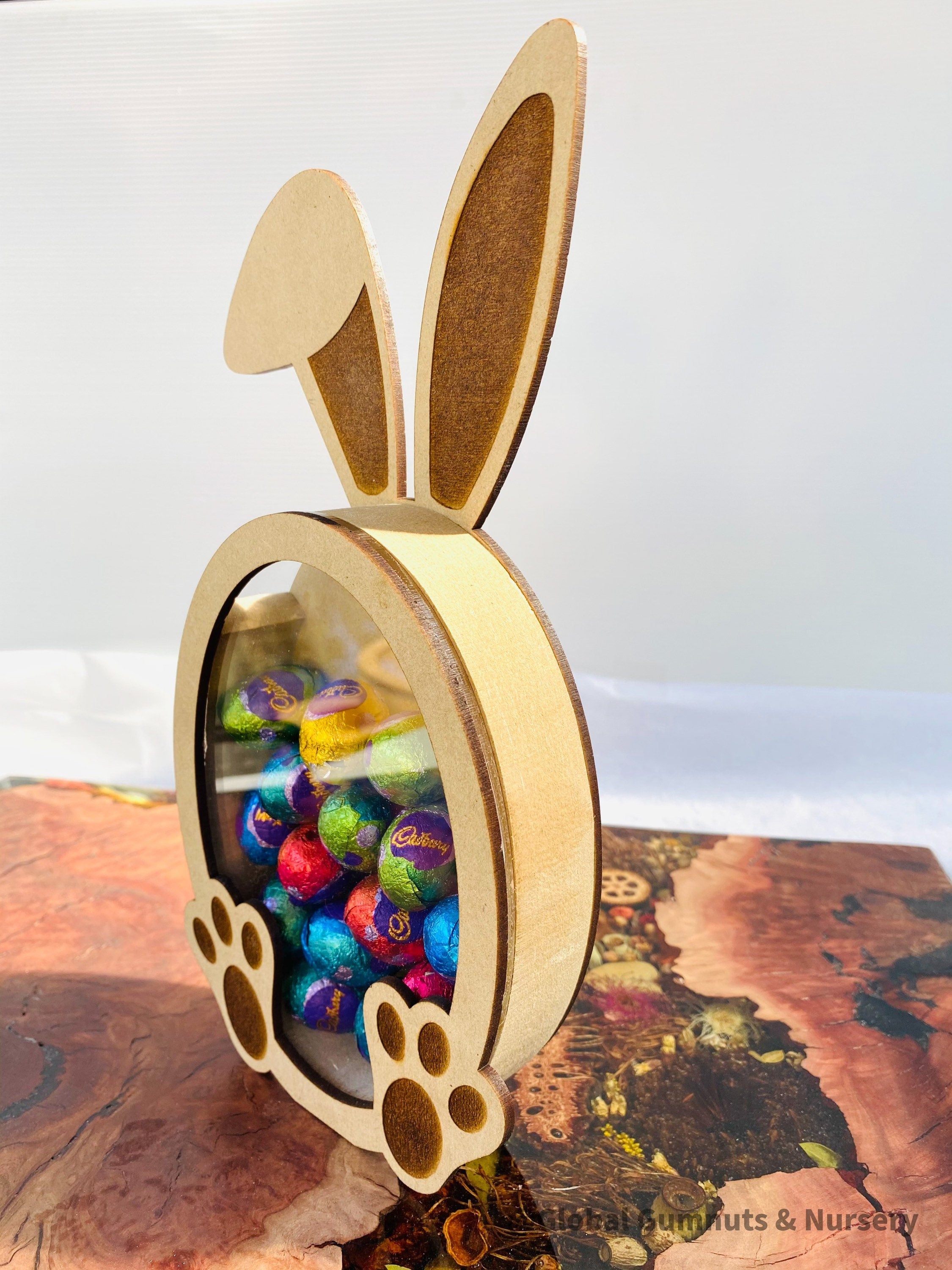 Bunny Rabbit Easter Egg Drops Piggy Bank: Rabbit-themed money box perfect for Easter gifts.
