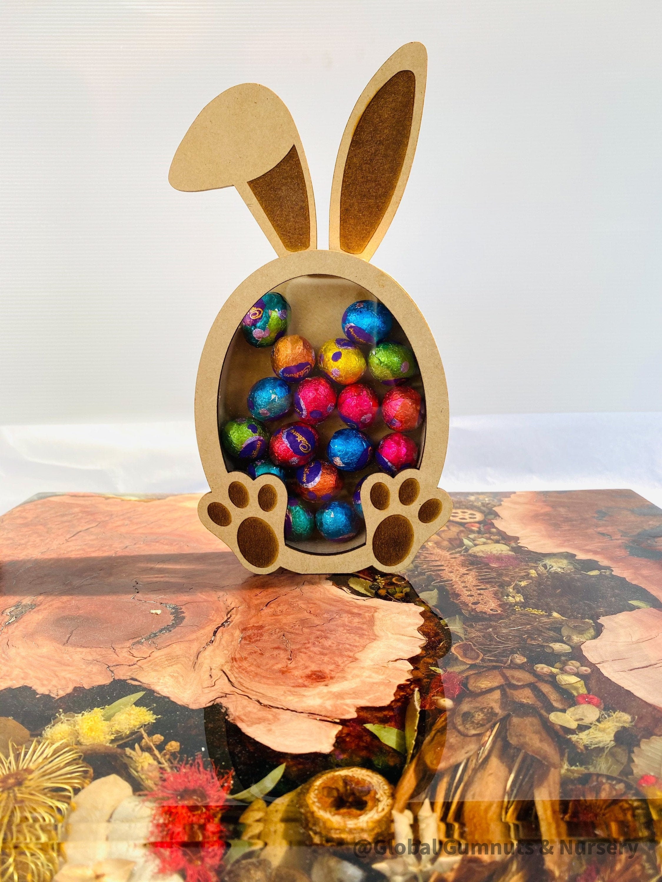Bunny Rabbit Easter Egg Drops Piggy Bank: Rabbit-themed money box perfect for Easter gifts.