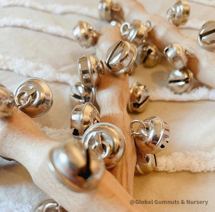 Jasmine bell rattle, a soft-sounding handmade rattle perfect for sensory play.