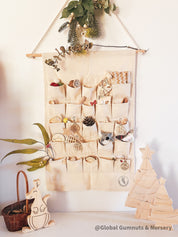 Linen Advent Calendar: Advent calendar with wooden numbers and festive design.