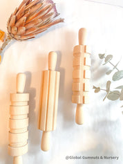 Set of 3 Patterned Rolling Pins: Wooden rolling pins with various patterns for creative play.