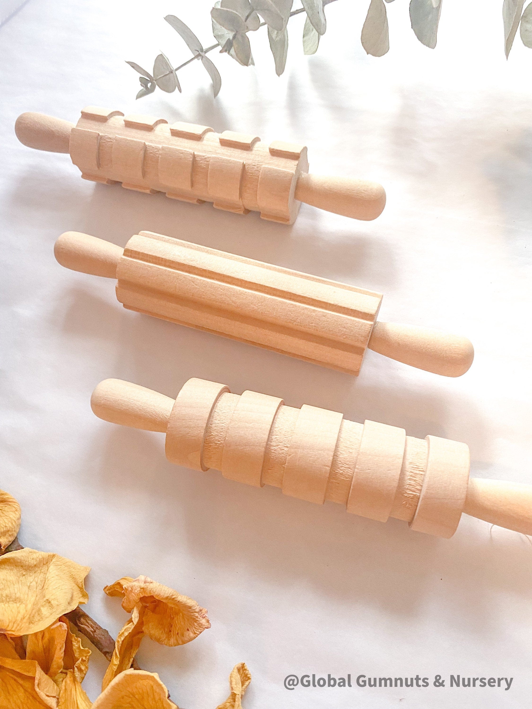 Set of 3 Patterned Rolling Pins: Wooden rolling pins with various patterns for creative play.