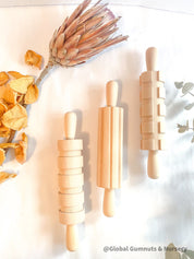 Set of 3 Patterned Rolling Pins: Wooden rolling pins with various patterns for creative play.