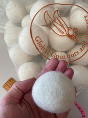 Giant felt marble, a 6-7cm wool ball ideal for sensory play, snowball-themed decor, or creative crafting.