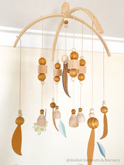 Australian Felt Gumleaf Mobile: Handmade Australian gumleaf mobile with dark wooden beads, inspired by native nature.