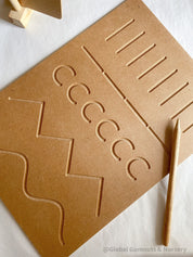 Patterns Tracing Board: Tracing board with wooden stylus for pre-writing practice.
