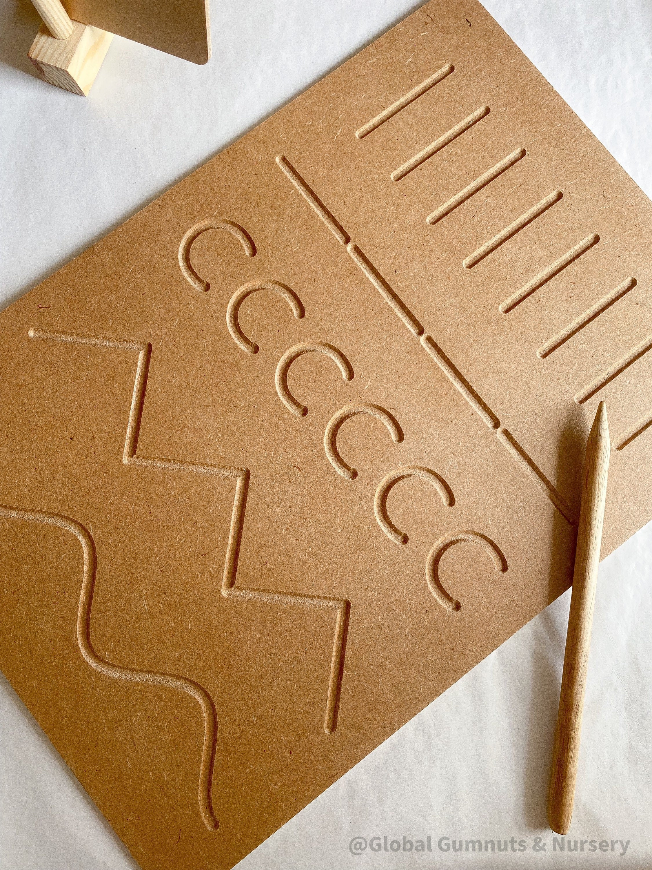 Patterns Tracing Board: Tracing board with wooden stylus for pre-writing practice.