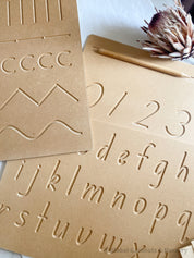 Lowercase Wooden Tracing Board: Board and stylus for letter tracing and writing practice.