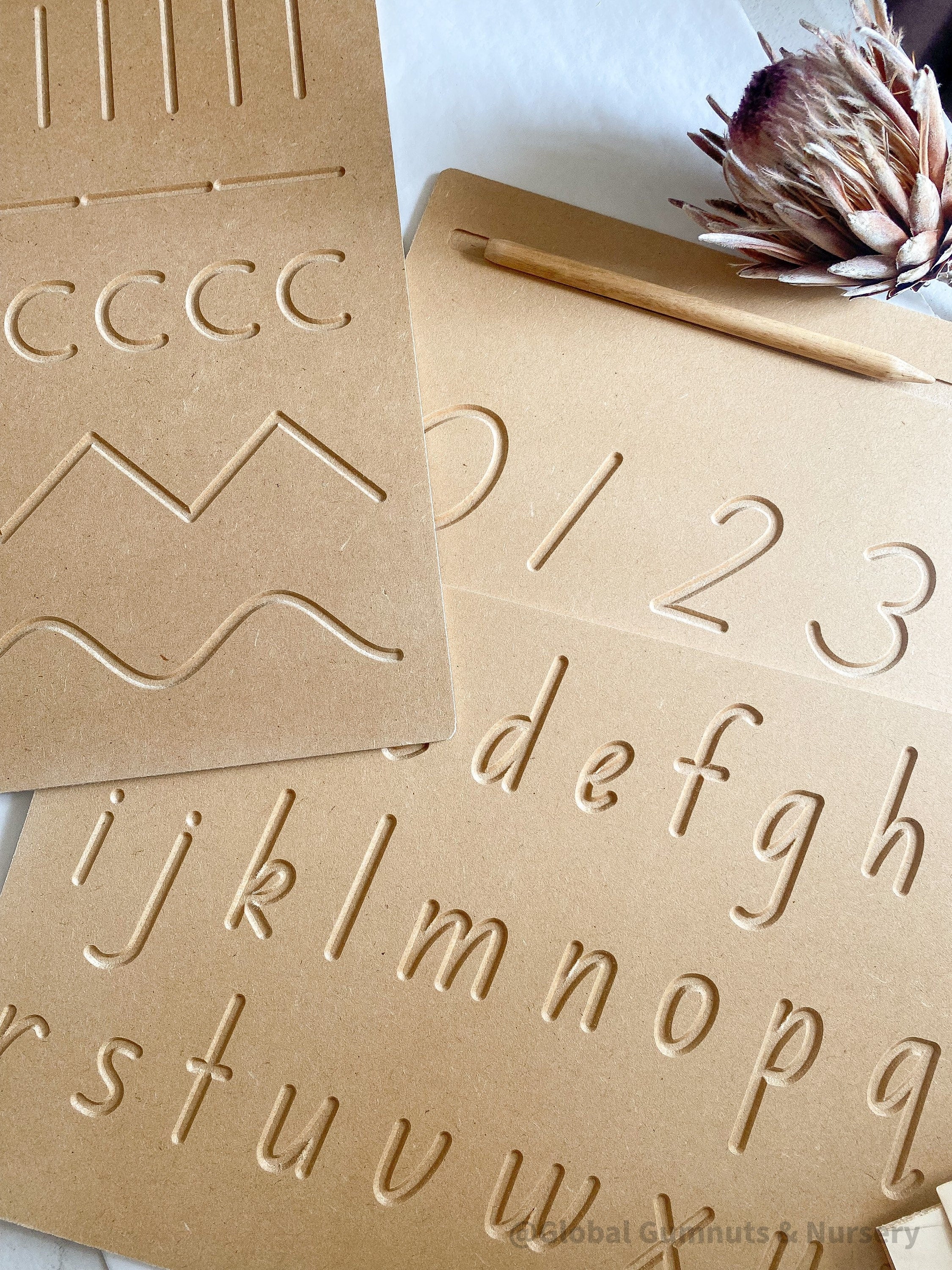 Lowercase Wooden Tracing Board: Board and stylus for letter tracing and writing practice.