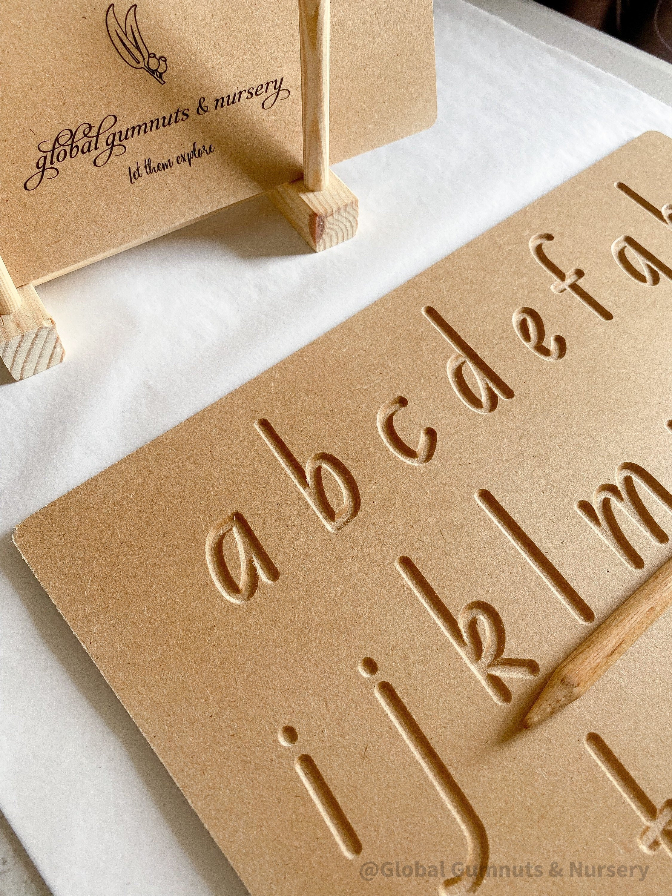 Lowercase Wooden Tracing Board: Board and stylus for letter tracing and writing practice.