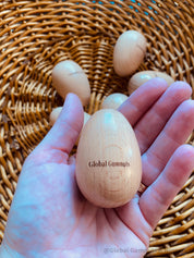 Wooden egg shakers, available individually or as a set of 2, perfect for Easter or musical fun.