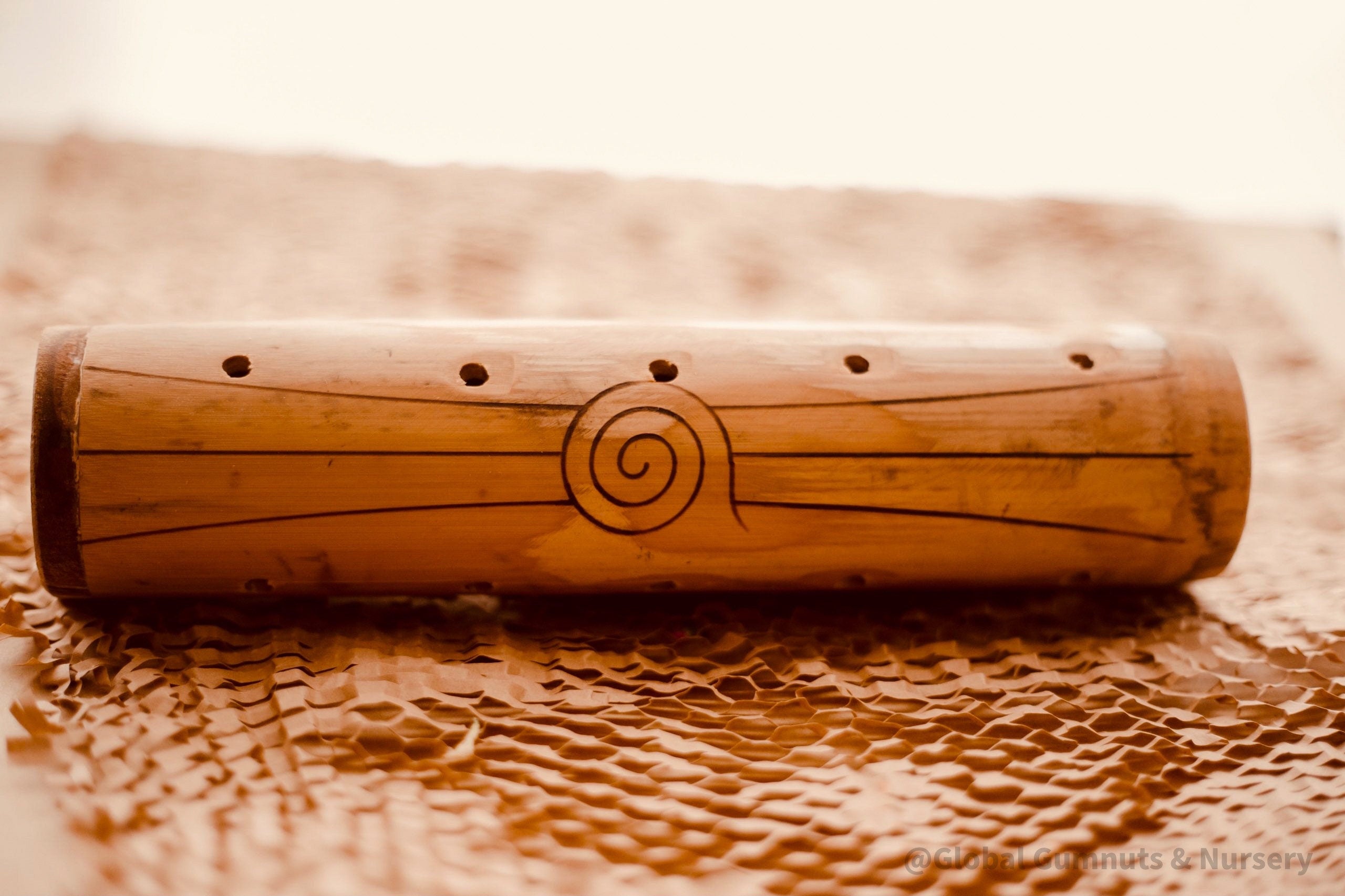 Natural cylindrical music shaker (22.5x6.5cm), a versatile percussion instrument.