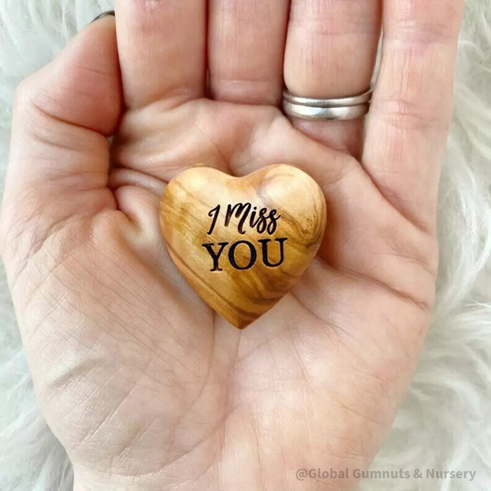 Gift a wooden heart with "I Miss You" sentiment, a thoughtful keepsake to send love and warm wishes.