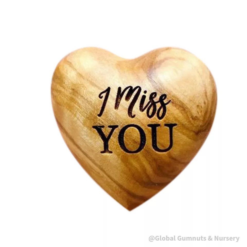 Gift a wooden heart with "I Miss You" sentiment, a thoughtful keepsake to send love and warm wishes.
