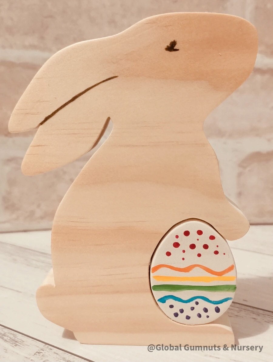 Handmade wooden bunny and egg set, a charming Easter-themed decor or playtime accessory.