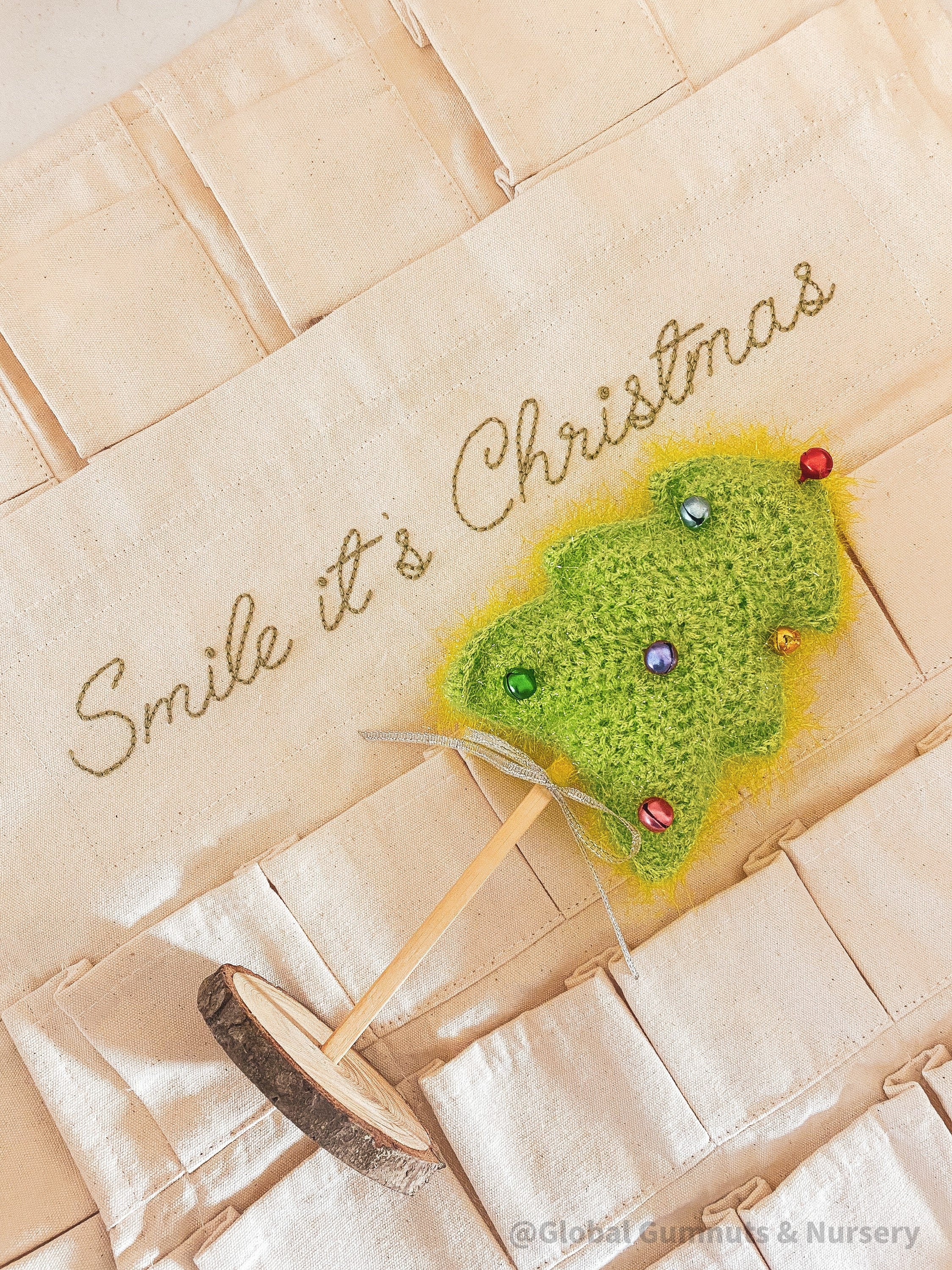 Linen Advent Calendar: Advent calendar with wooden numbers and festive design.