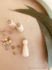 Eucalyptus Caps: Wooden doll caps made from eucalyptus seeds for sensory play.