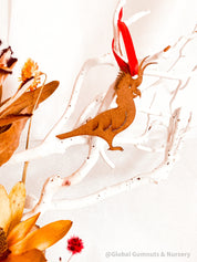 Cockatoo Ornament: Wooden ornament of a cockatoo for Christmas decorations.