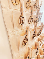 Linen Advent Calendar: Advent calendar with wooden numbers and festive design.