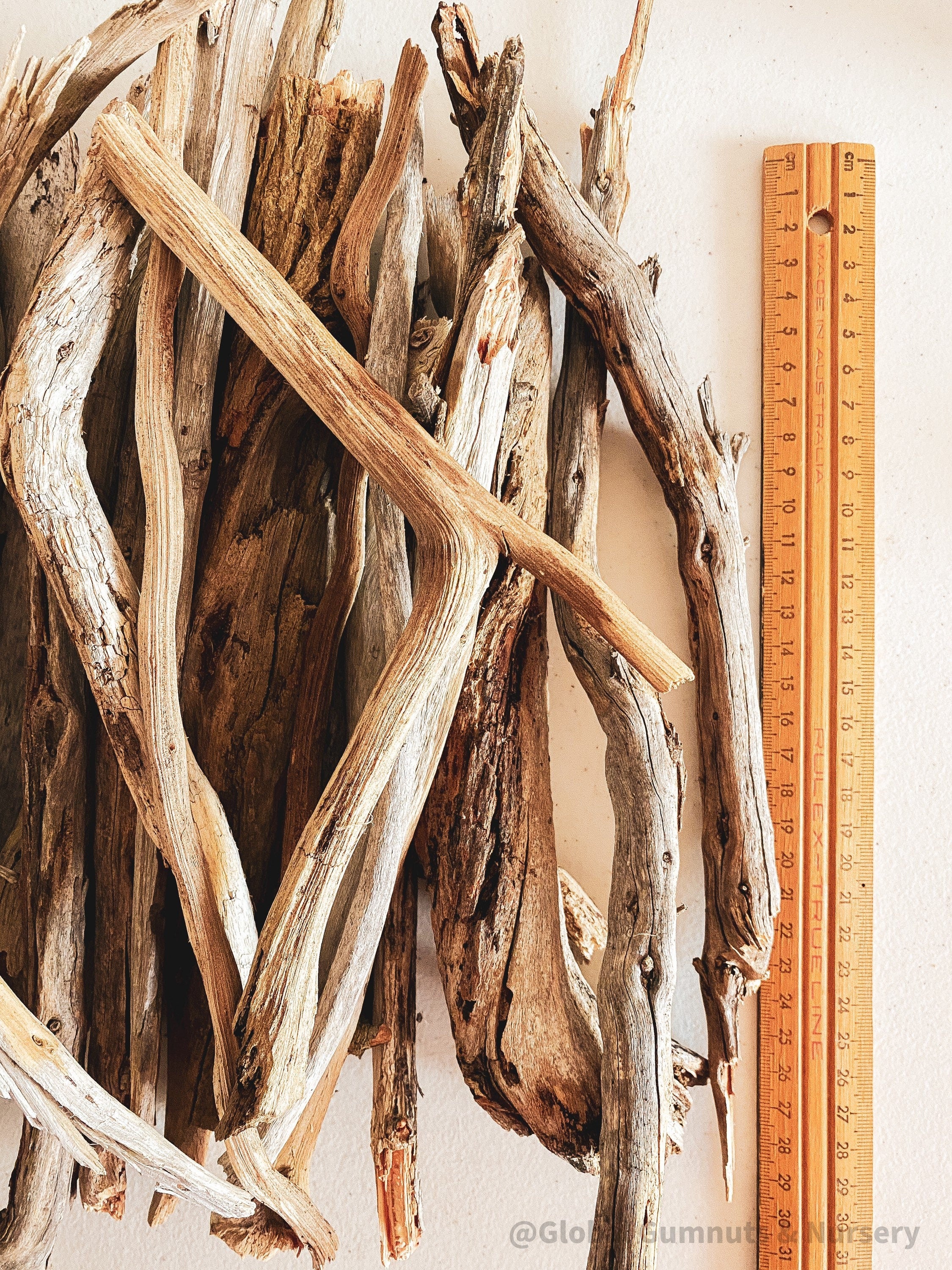 Natural driftwood pieces, versatile for crafts, decor, or beach-themed designs.