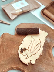 Rolling Pin Tree Branch: Natural wooden rolling pin ideal for play dough and sensory activities.