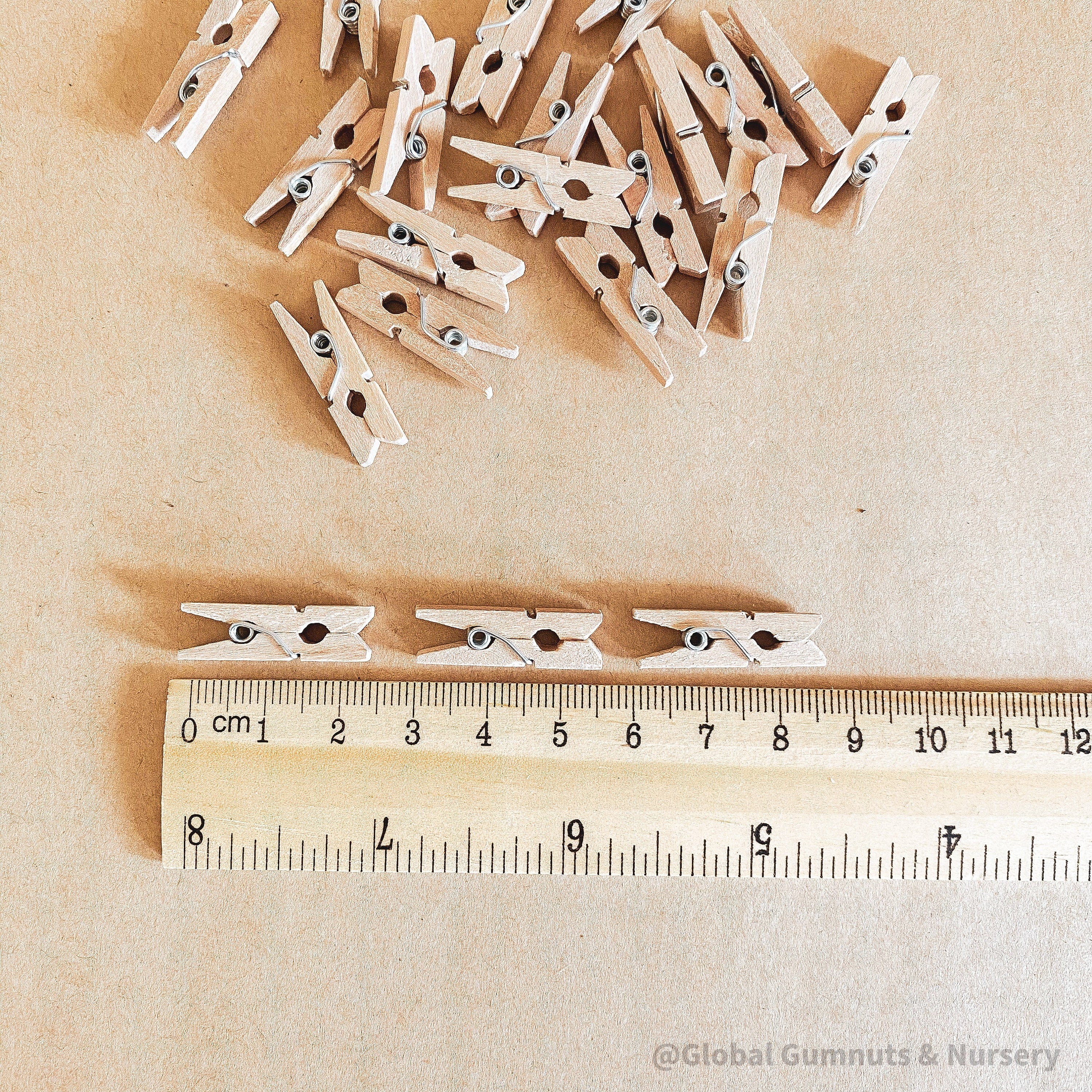 Mini wooden pegs, versatile clips ideal for advent calendars or craft projects.