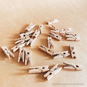 Mini wooden pegs, versatile clips ideal for advent calendars or craft projects.