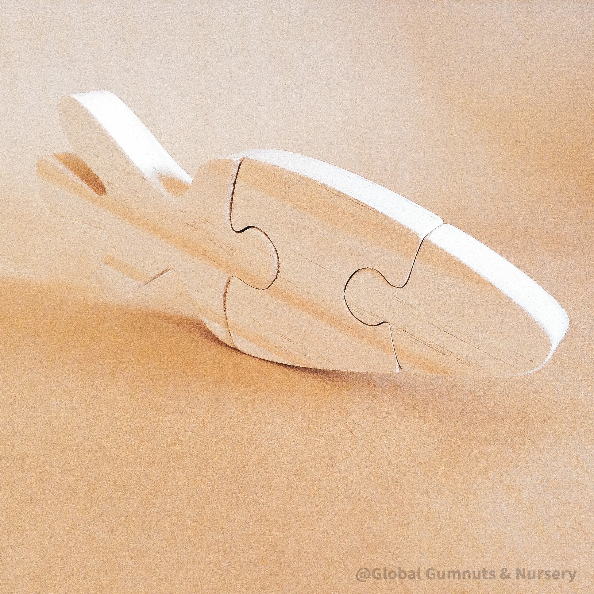Handmade Wooden Carrot Puzzle: Three-piece wooden puzzle shaped like a carrot.