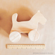Handmade wooden dog figurine, a playful toy and thoughtful first gift for animal-loving children.