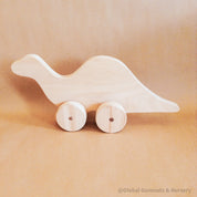 Personalized Dinosaur Toy: Eco-friendly wooden dinosaur toy for toddlers with custom options.