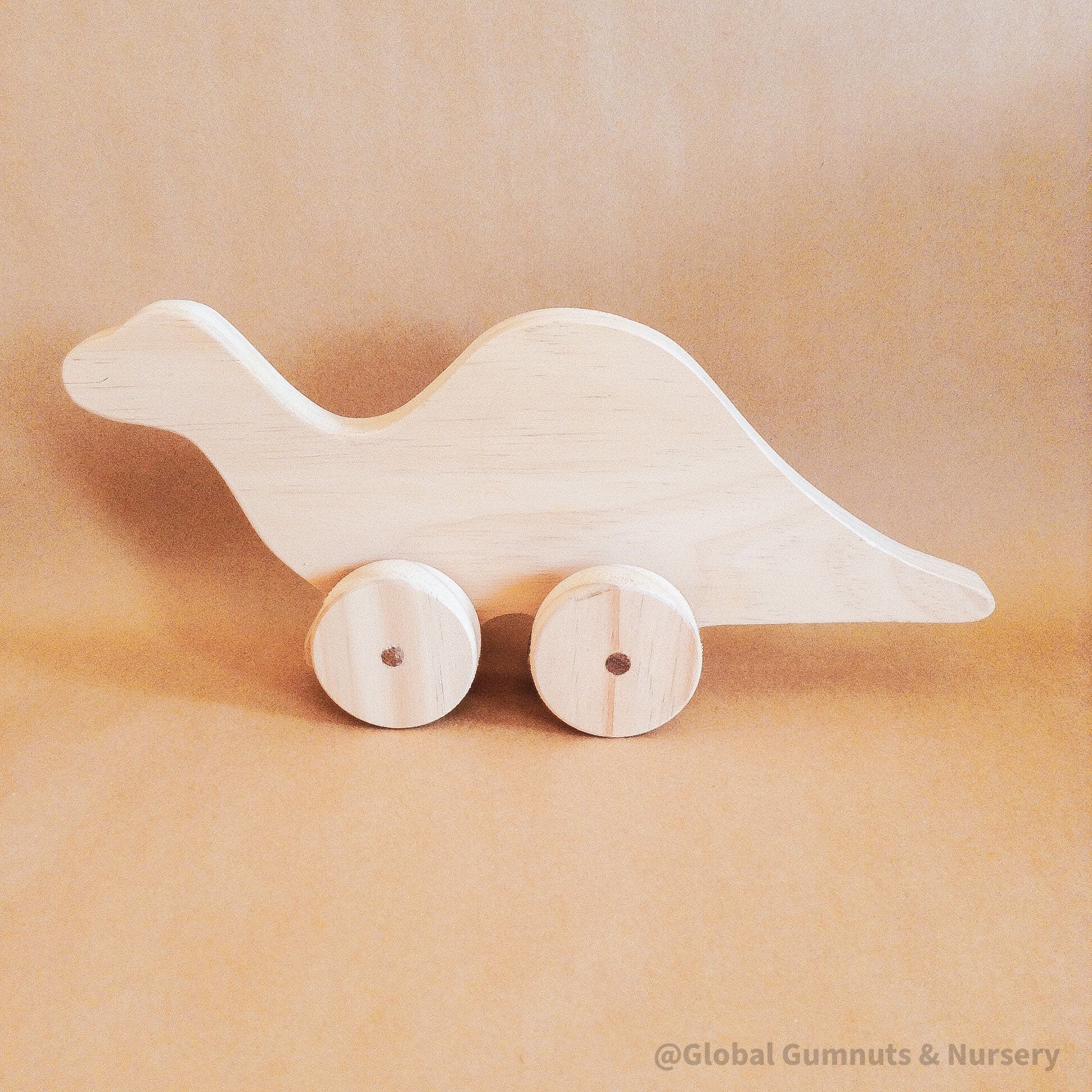 Personalized Dinosaur Toy: Eco-friendly wooden dinosaur toy for toddlers with custom options.