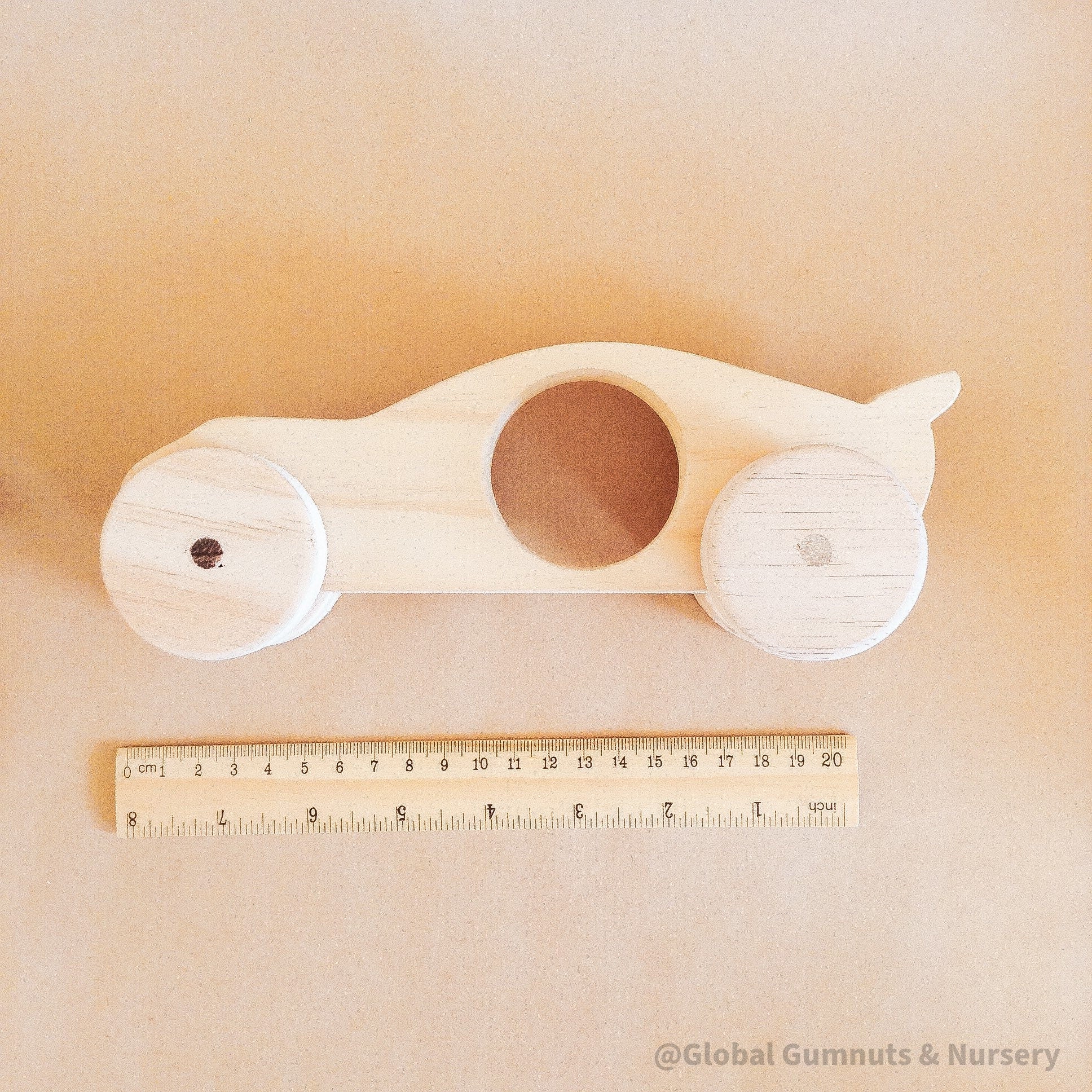 Race Car with Spoiler: Handmade wooden race car with push-pull functionality.