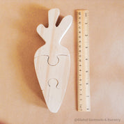 Handmade Wooden Carrot Puzzle: Three-piece wooden puzzle shaped like a carrot.