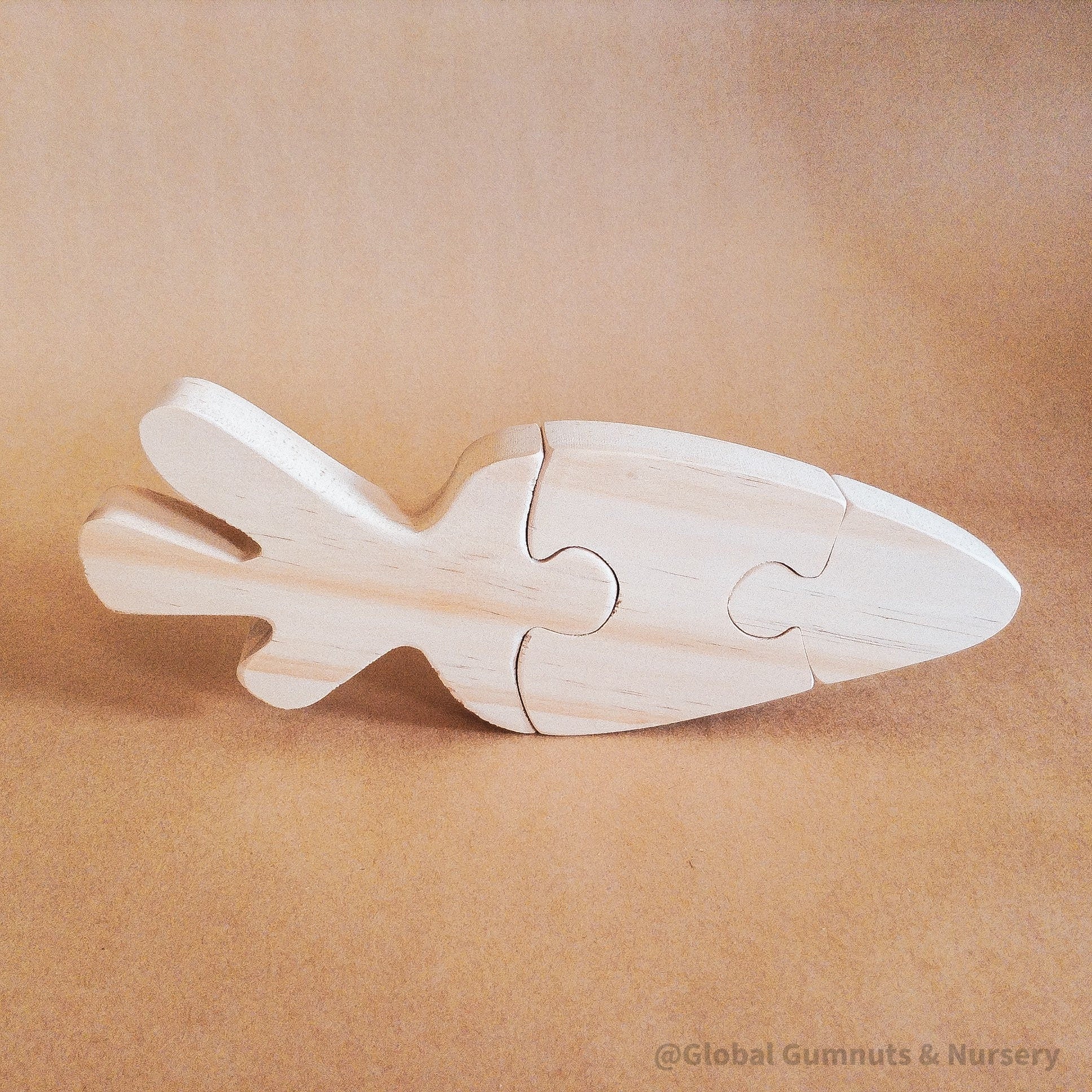 Handmade Wooden Carrot Puzzle: Three-piece wooden puzzle shaped like a carrot.