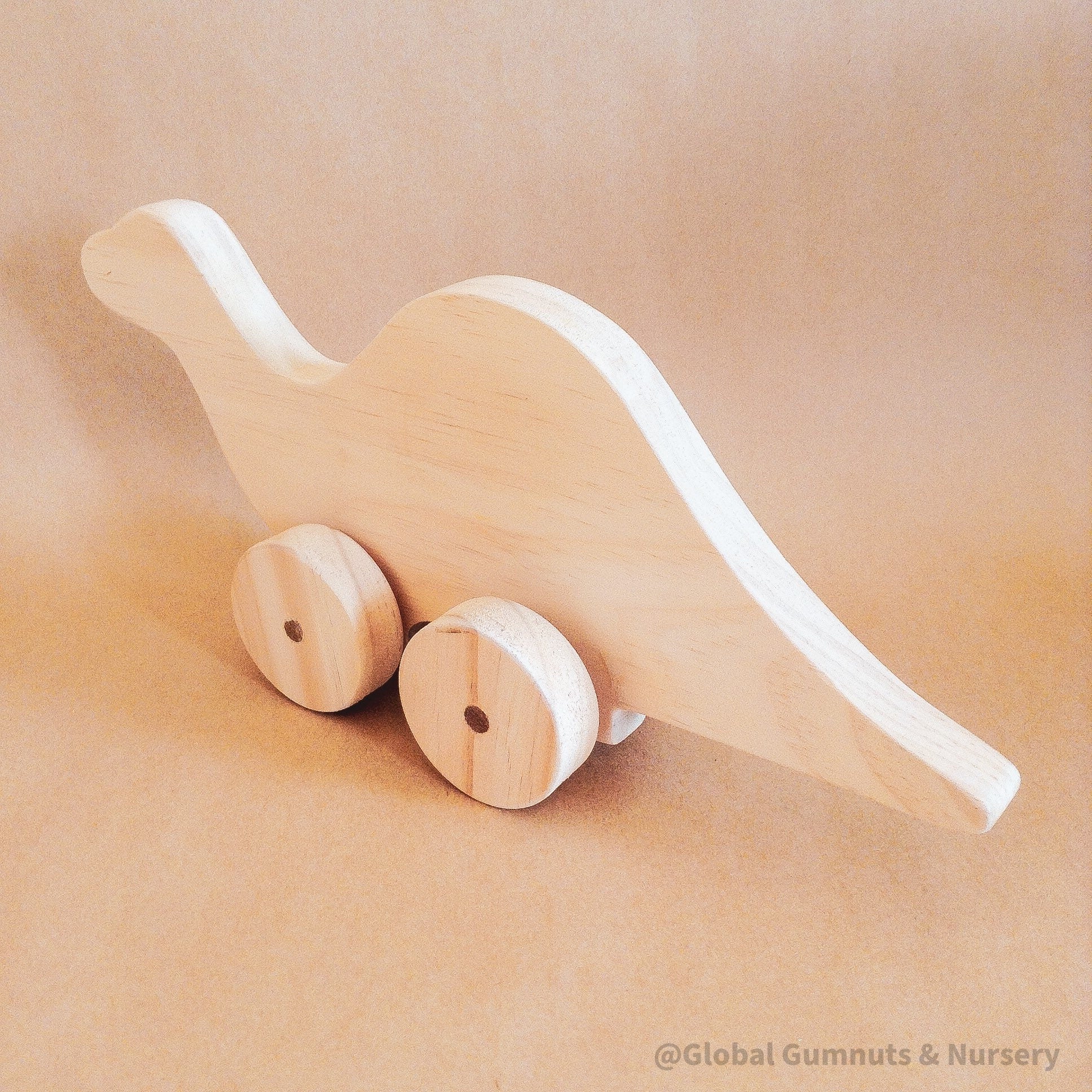 Personalized Dinosaur Toy: Eco-friendly wooden dinosaur toy for toddlers with custom options.