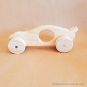 Race Car with Spoiler: Handmade wooden race car with push-pull functionality.