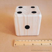 Oversized wooden dice, perfect for garden games, party entertainment, or creative displays.