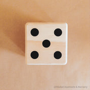 Oversized wooden dice, perfect for garden games, party entertainment, or creative displays.