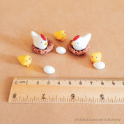 resin chickens & chicks set: mini resin chicken family set, perfect for crafting or farm-themed decor.