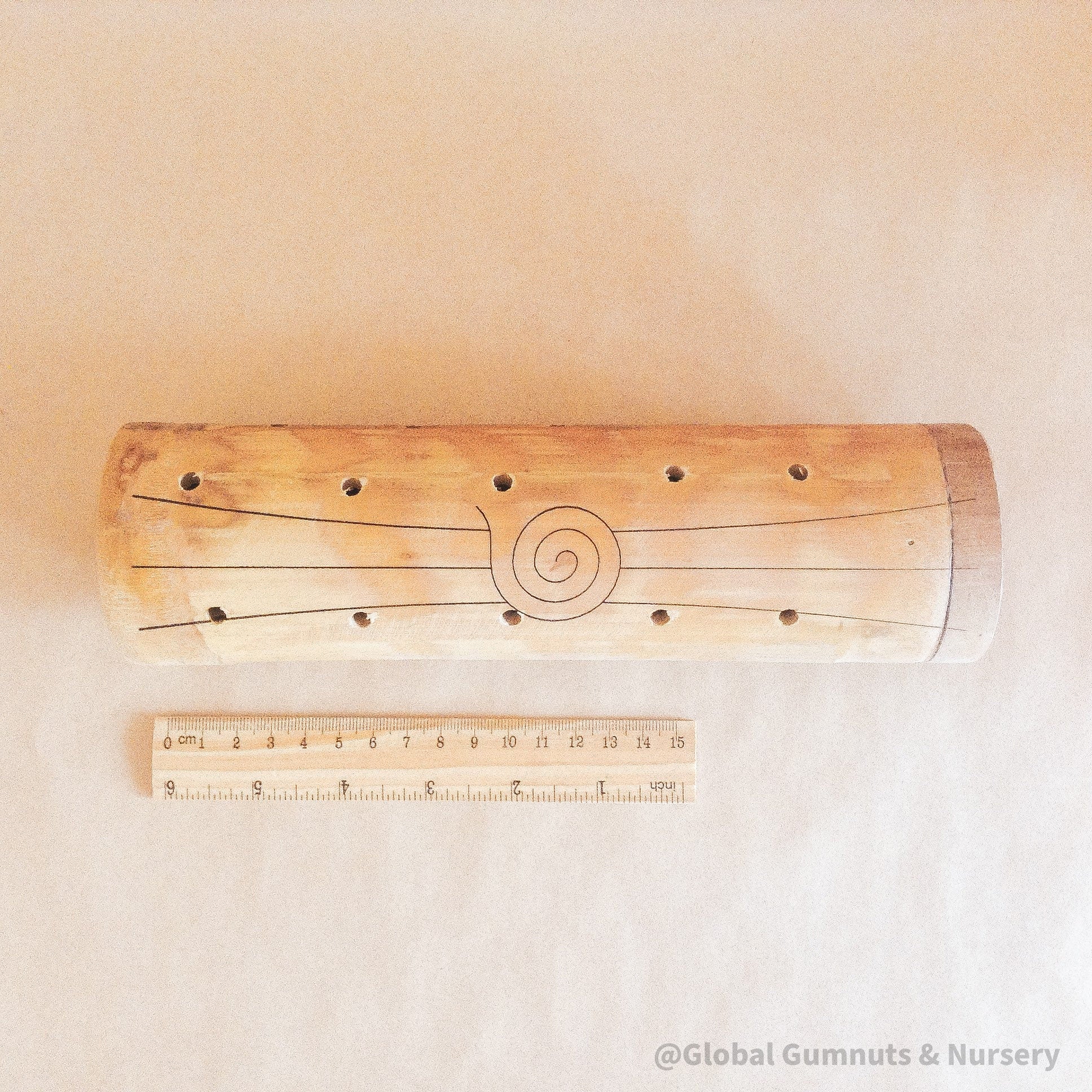 Natural cylindrical music shaker (22.5x6.5cm), a versatile percussion instrument.