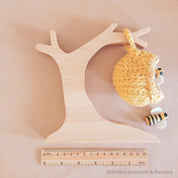 Natural Wooden Beehive Crochet Tree: A wooden crochet tree resembling a beehive, perfect for decor, crafts, or children’s creative play.