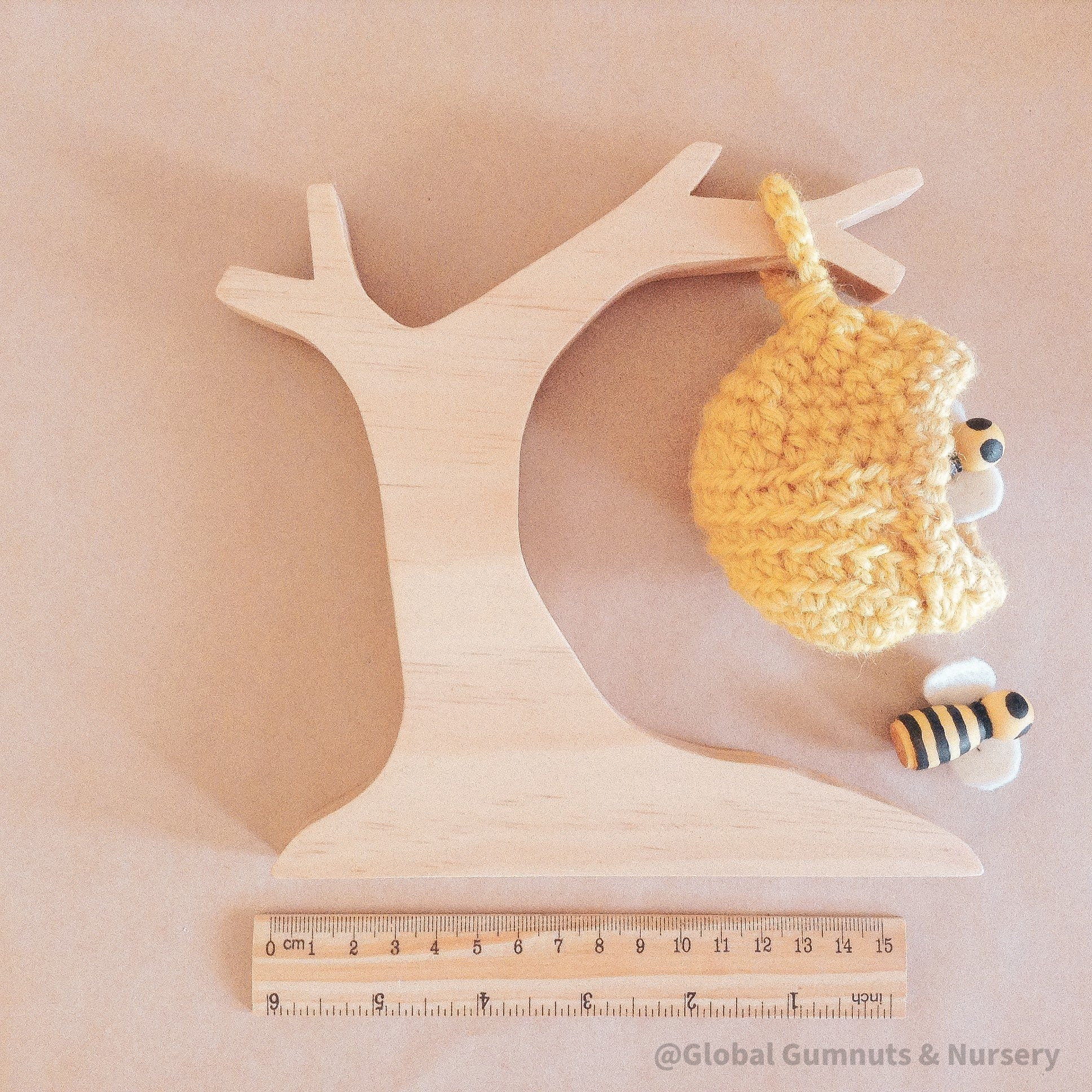 Natural Wooden Beehive Crochet Tree: A wooden crochet tree resembling a beehive, perfect for decor, crafts, or children’s creative play.