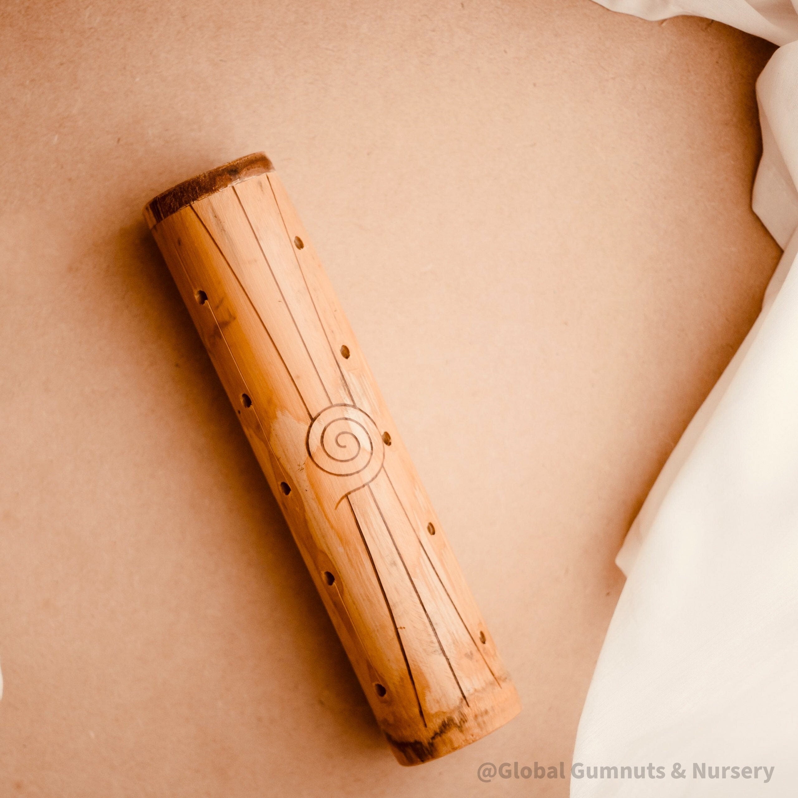 Natural cylindrical music shaker (22.5x6.5cm), a versatile percussion instrument.